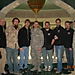 The crew with Chaplain Fischer in the middle and Lt. Col. Wood at the side.