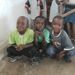 3 young boys in the church.