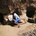 A woman sieving muddy water to make it drinkable