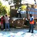 The band help unload food from truck