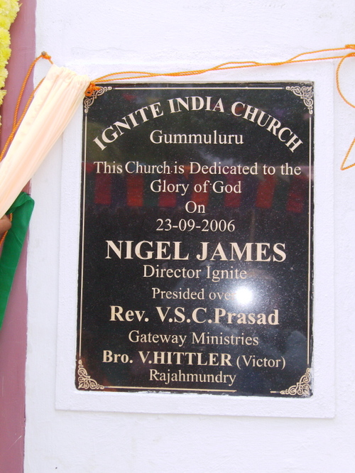 The plaque outside Gummuluru church.