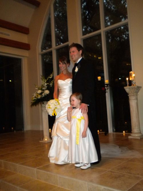 The newlyweds and their flower girl.